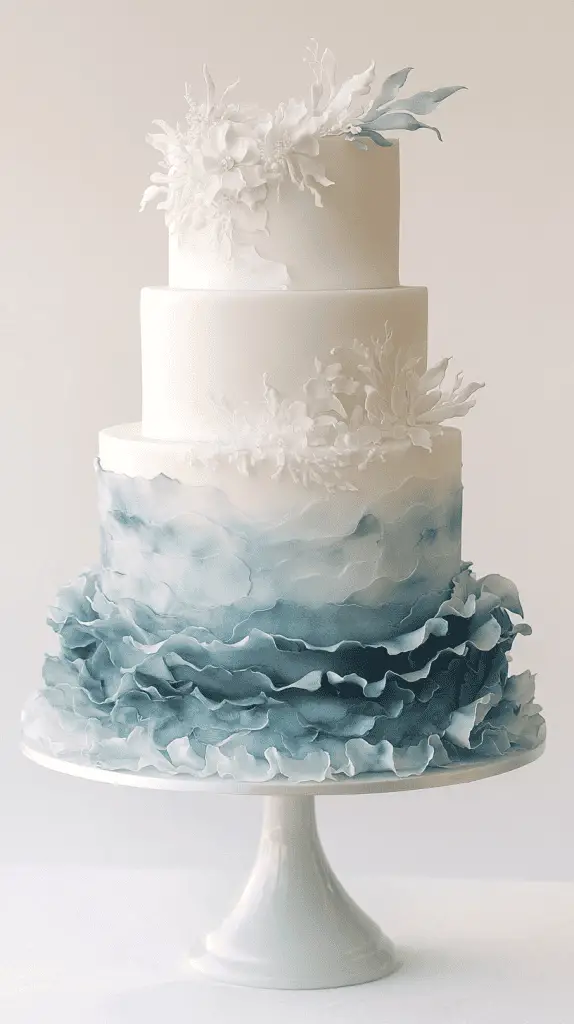 three-tier opalite ocean wedding cake showcasing hand-painted watercolor currents in pale blue and white