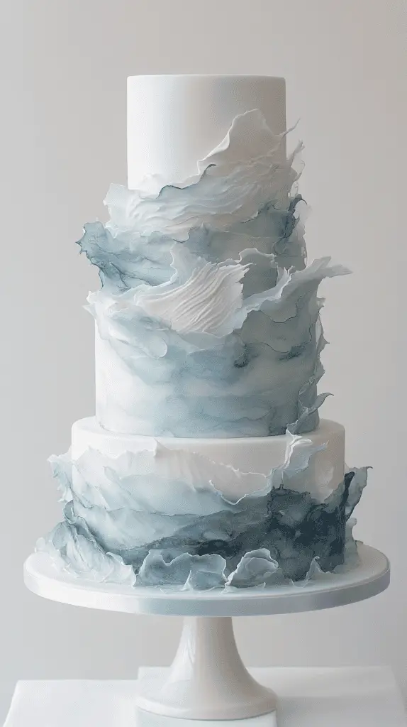 three-tier opalite ocean wedding cake showcasing hand-painted watercolor currents in pale blue and white